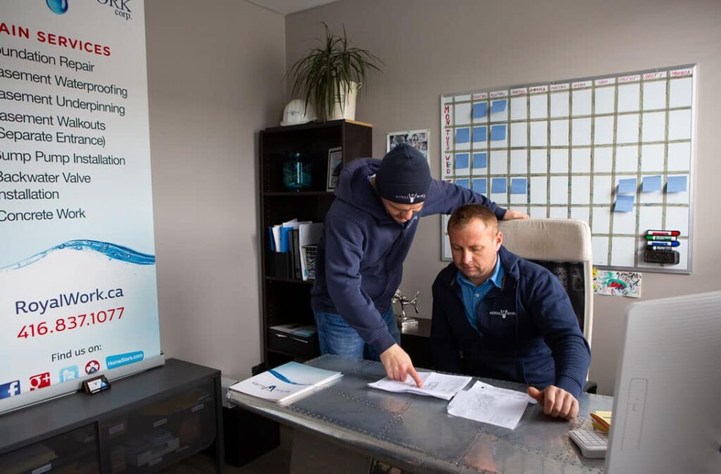 Royal Work Basement Waterproofing Company. Owner and techician under discussion.